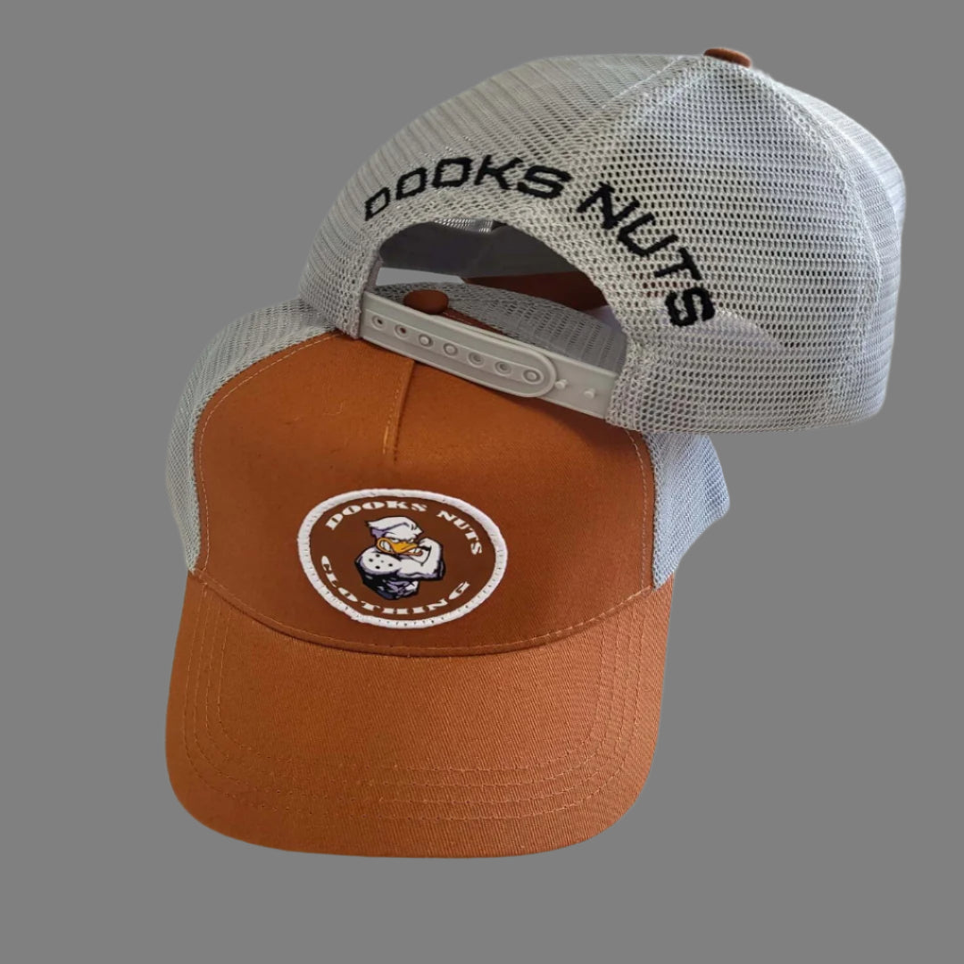 Dooks nuts truckers style tan and grey cap with patch logo.